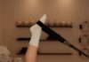 “집콕 시대의 건강 비결, 필라테스가 주목받는 이유와 실천법” Woman does pilates exercise on a reformer machine.