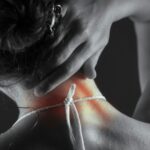 만성 피로와 허리 통증, 직장인 건강 이상신호에 주목해야 Woman's neck with highlighted pain area.